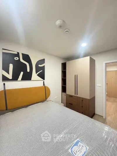 Modern bedroom with stylish decor and ample storage space