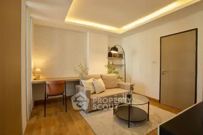 Modern living room with cozy sofa, stylish lighting, and elegant decor in a contemporary apartment.