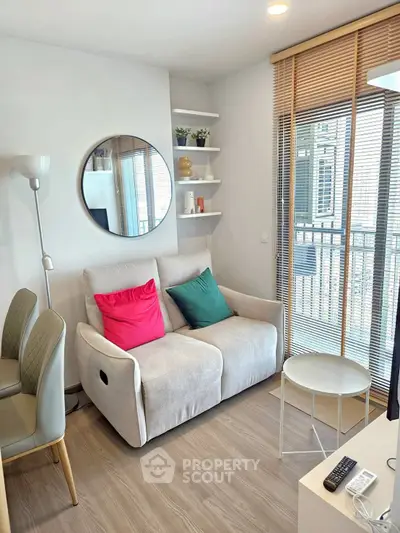 Cozy living room with modern decor and balcony view