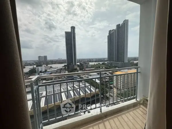 Stunning high-rise balcony view with cityscape and river, perfect for urban living.