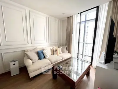 Elegant living room with large windows and stylish decor in modern apartment