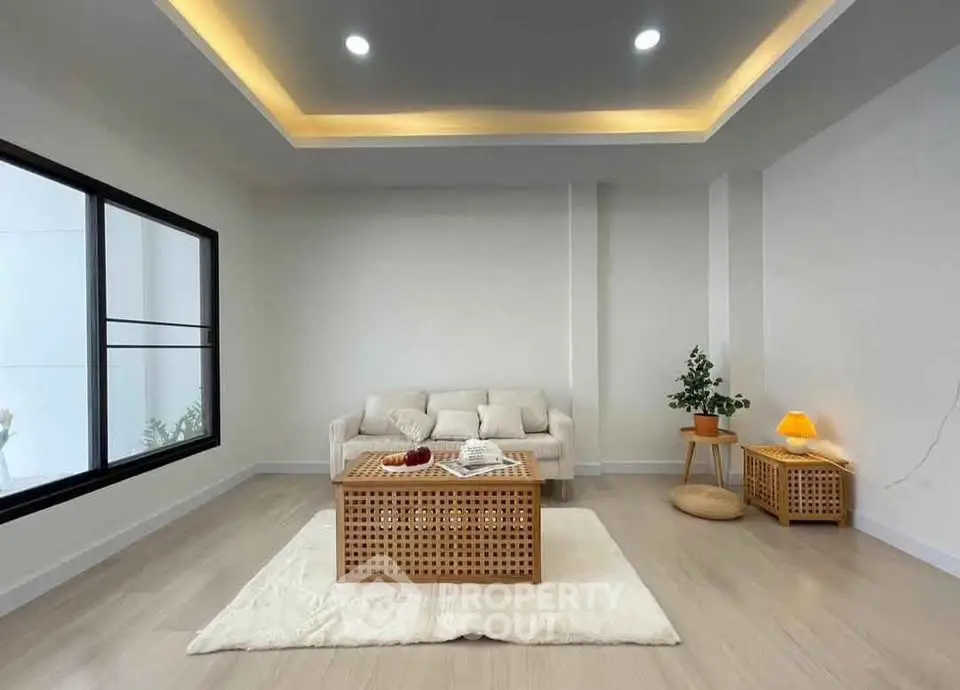 Modern minimalist living room with cozy seating and stylish decor