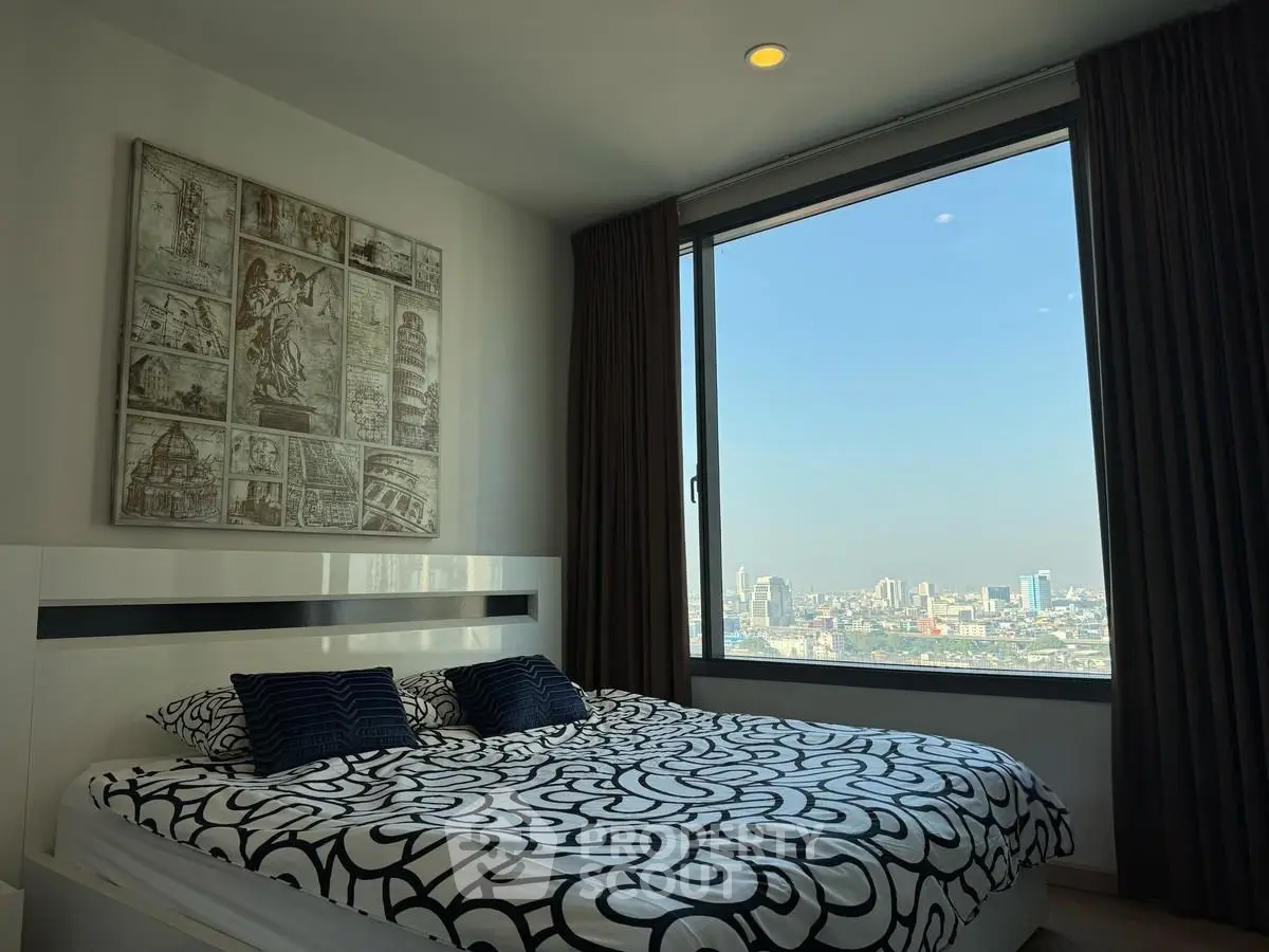 Modern bedroom with stunning city view and stylish decor