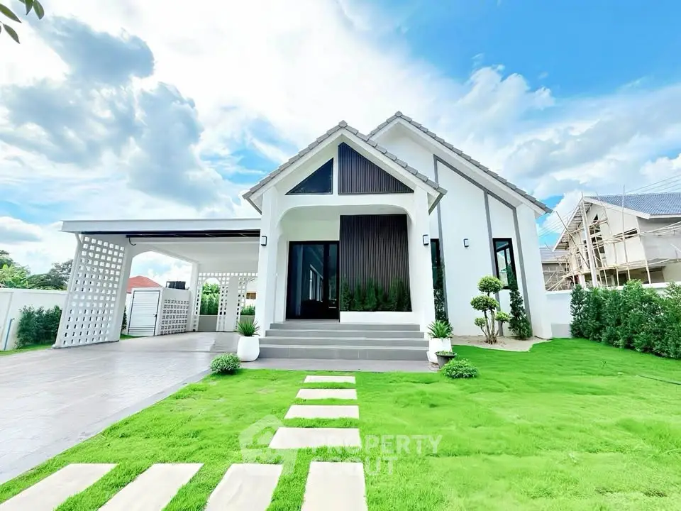 Stunning modern house with lush green lawn and spacious driveway, perfect for family living.