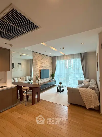 Spacious modern living room with open kitchen and large windows