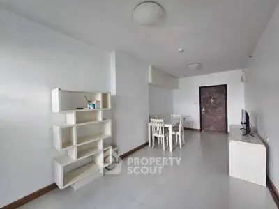 Spacious minimalist living room with modern furniture and dining area