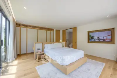 Spacious modern bedroom with natural light and minimalist design