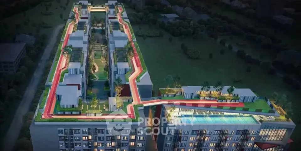 Stunning aerial view of modern apartment complex with rooftop pool and garden.