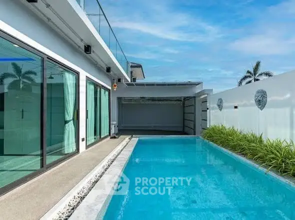 Luxurious modern home with private pool and sleek design.