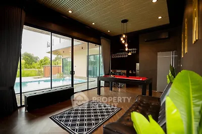 Luxurious living room with pool view and modern decor