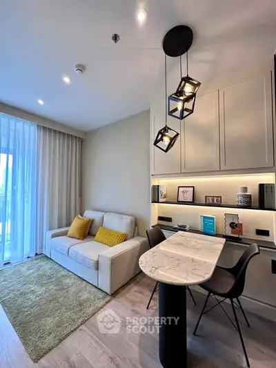 Modern living room with stylish lighting and cozy seating area