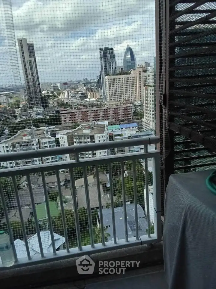 Stunning cityscape view from a high-rise balcony, perfect for urban living enthusiasts.