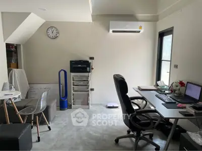 Modern home office with sleek furniture and natural light, perfect for productivity.