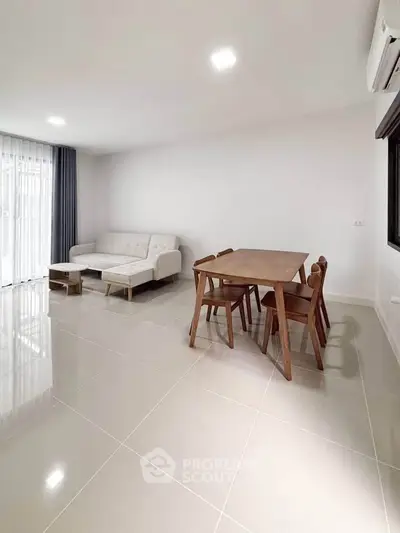 Modern living room with sleek furniture and natural light