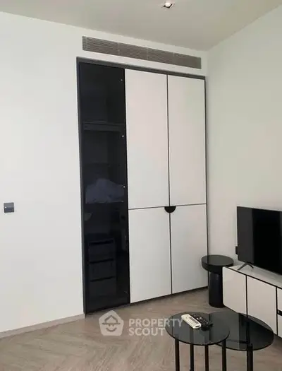 Modern living room with sleek storage and TV setup