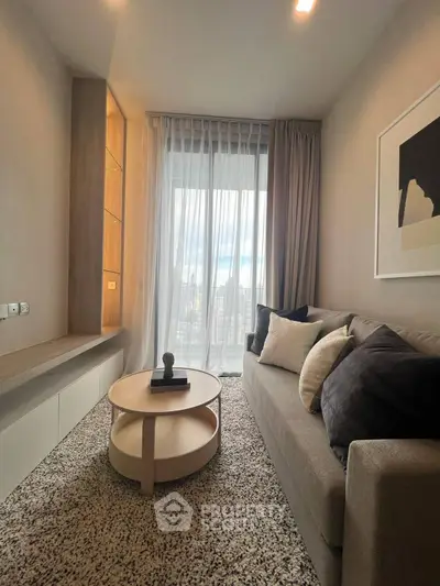 Cozy modern living room with plush sofa and stylish decor, perfect for relaxation.