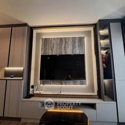 Modern living room with stylish TV wall unit and ambient lighting