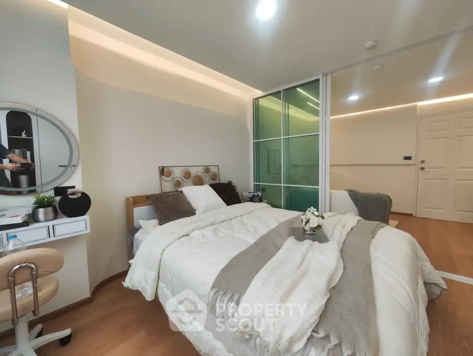 Modern bedroom with cozy decor and stylish lighting