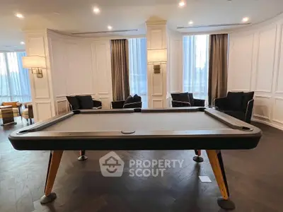 Luxurious living room with elegant pool table and stylish seating area