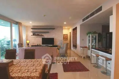 Spacious living room with elegant decor and open layout, featuring a cozy seating area and modern furnishings.