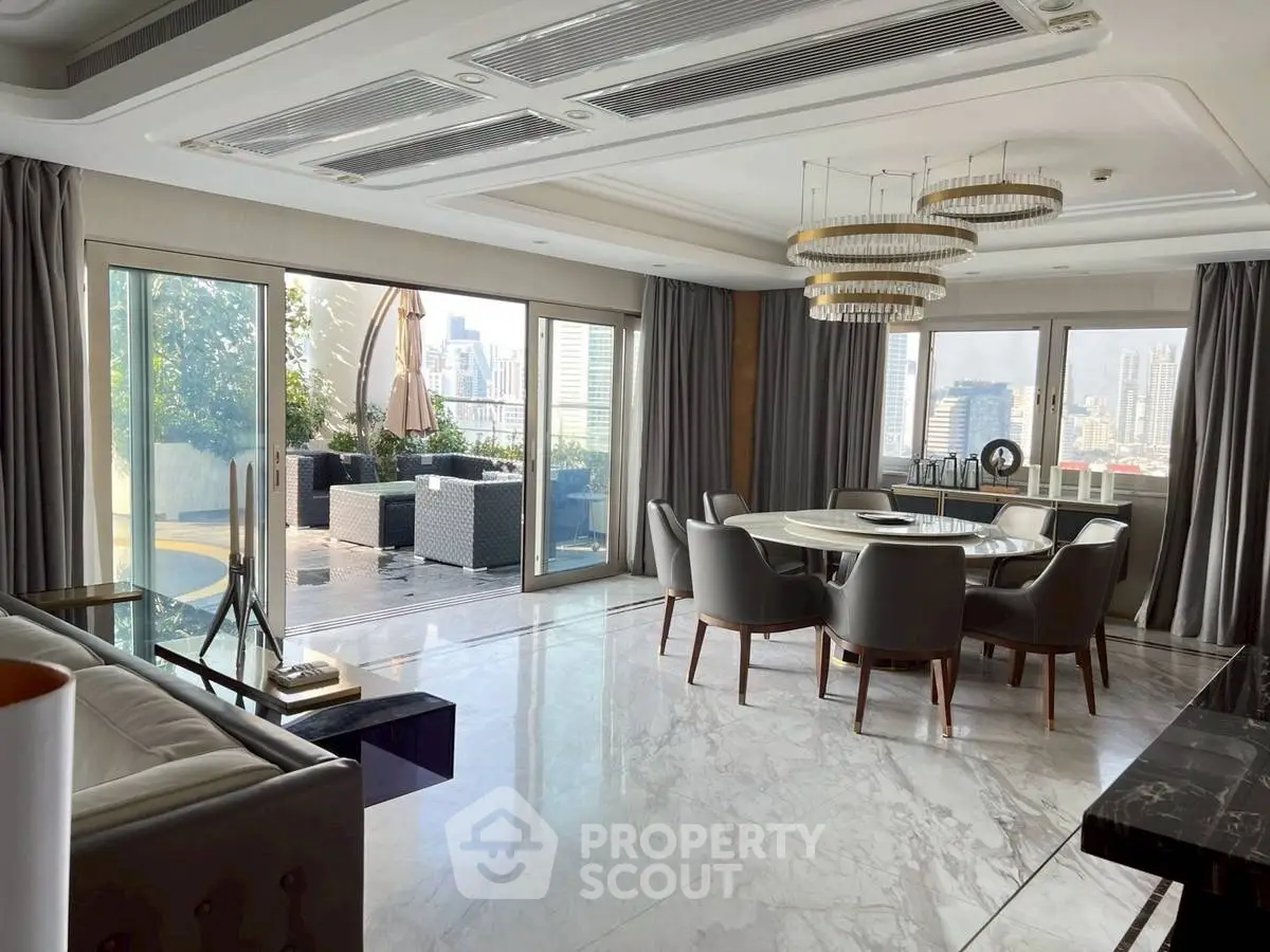 Luxurious living room with marble floors and city view, featuring elegant dining area and spacious balcony.