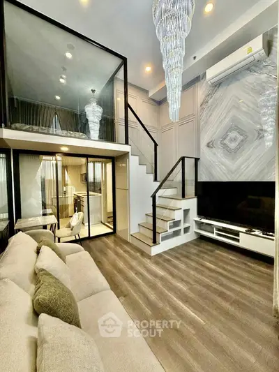 Luxurious modern living room with mezzanine, elegant chandelier, and stylish decor