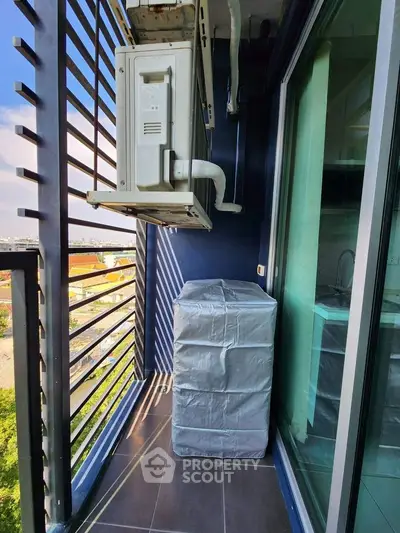 Modern balcony with city view and air conditioning unit