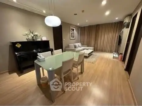 Spacious living room with modern decor and elegant dining area, perfect for entertaining guests.