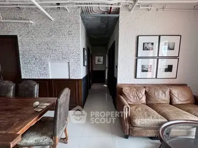 Chic industrial-style living room with exposed brick and leather sofa