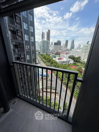 Stunning cityscape view from a modern high-rise balcony, perfect for urban living enthusiasts.