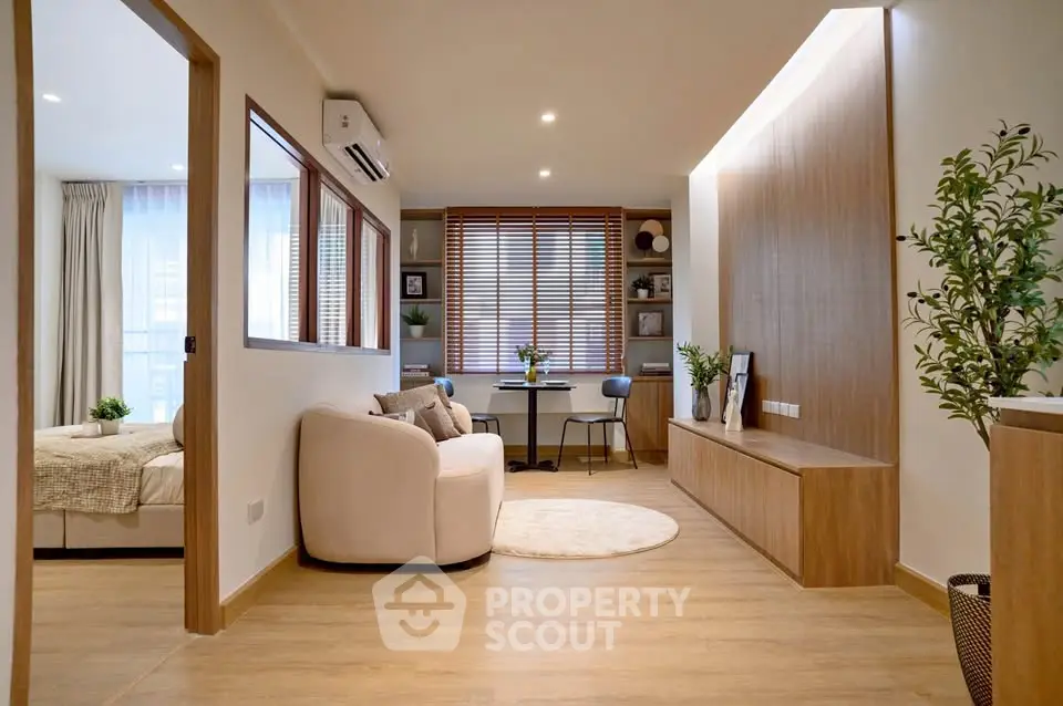 Modern living room with cozy seating and stylish decor in a contemporary apartment.