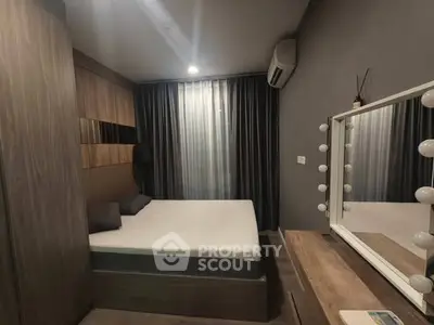 Modern bedroom with stylish decor and large mirror, featuring cozy lighting and elegant furnishings.