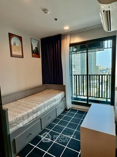 Modern bedroom with city view and stylish decor in high-rise apartment