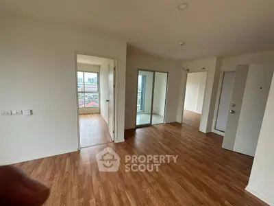 Spacious modern apartment with wooden flooring and ample natural light