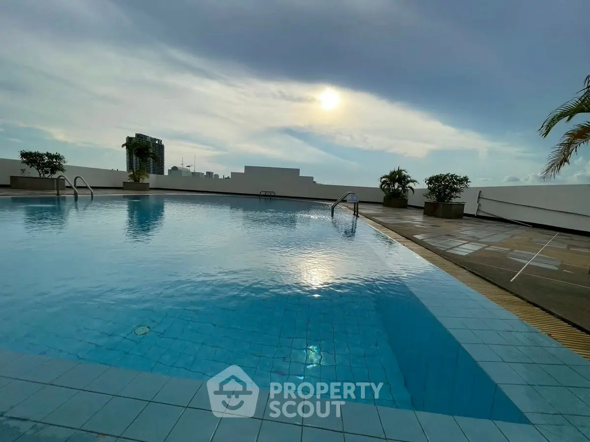 Stunning rooftop pool with panoramic city views and serene ambiance.