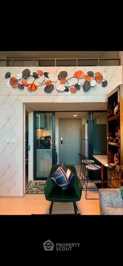 Stylish modern living room with artistic wall decor and cozy seating area