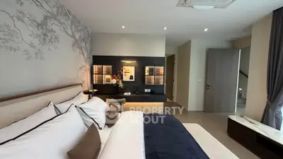 Luxurious modern bedroom with elegant decor and ambient lighting, featuring a cozy bed and stylish wall art.