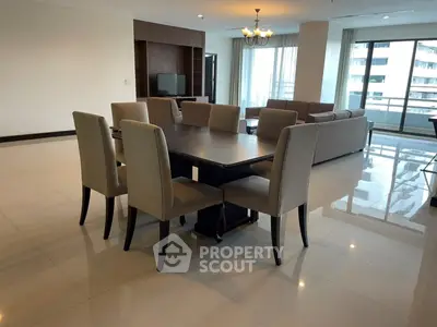 Spacious modern living room with elegant dining area and large windows.