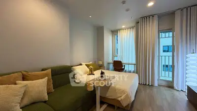 Modern studio apartment with cozy living area and stylish decor