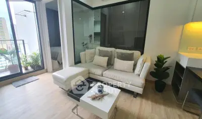 Modern living room with cozy sofa and balcony view in stylish apartment