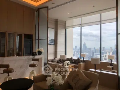 Luxurious living room with panoramic city view, elegant decor, and modern furnishings in a high-rise apartment.