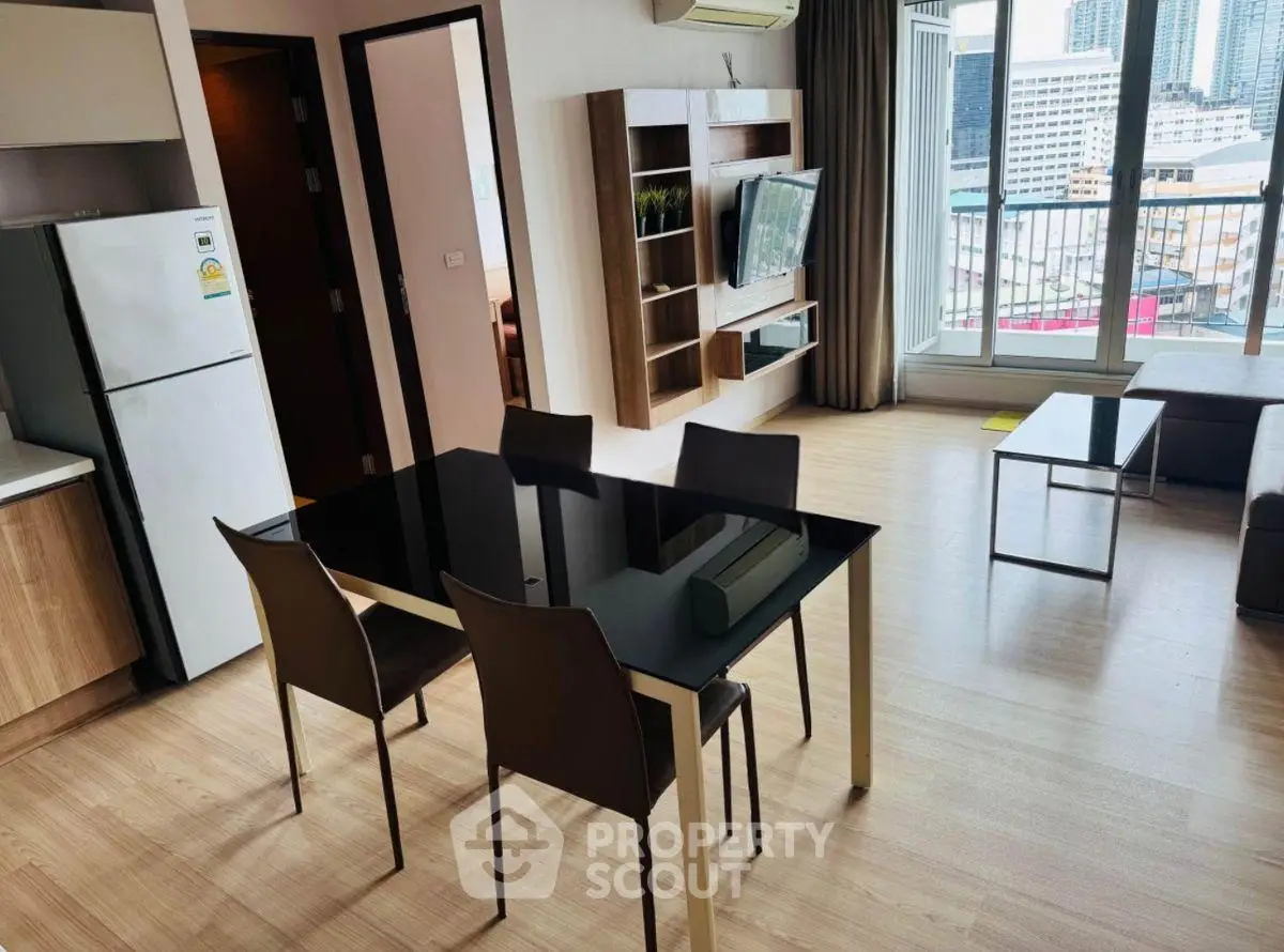 Modern living room with sleek furniture and city view balcony in urban apartment