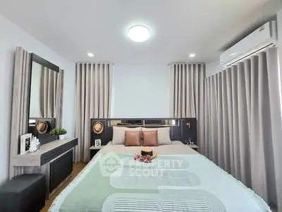 Modern bedroom with stylish decor and natural light, featuring a cozy bed and elegant curtains.