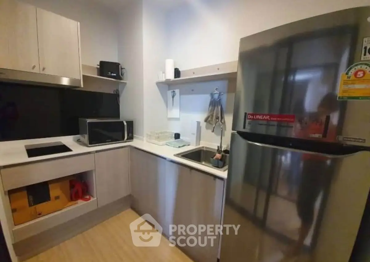 Modern kitchen with sleek appliances and ample storage space