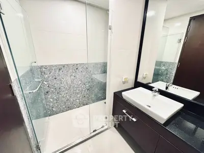 Modern bathroom with sleek design and glass shower enclosure