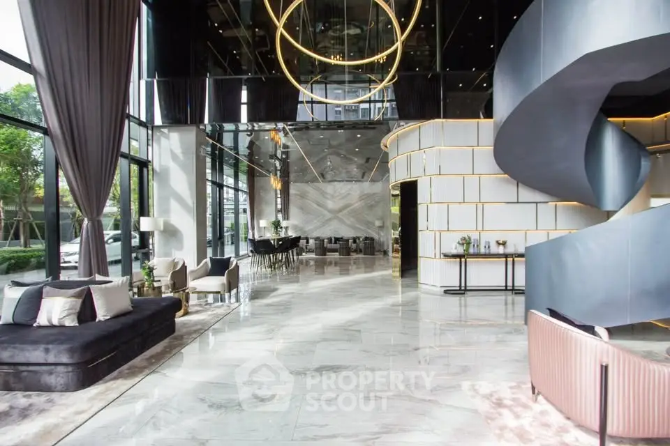 Luxurious modern lobby with elegant spiral staircase and chic seating area