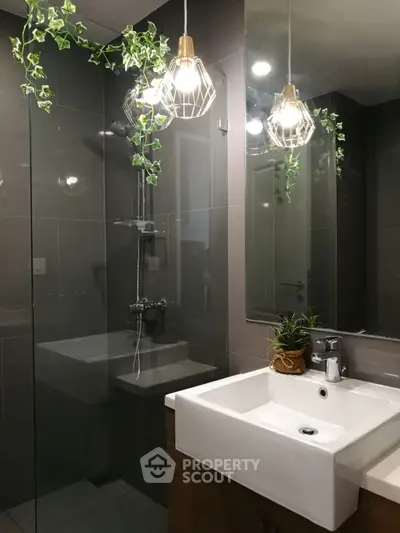 Modern bathroom with sleek fixtures and stylish lighting