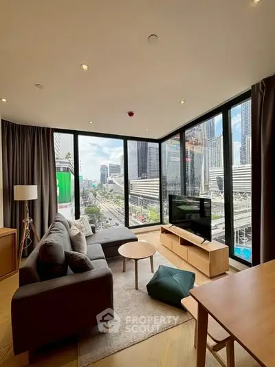 Modern living room with panoramic city view and stylish furnishings