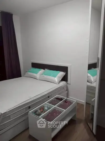 Cozy modern bedroom with stylish decor and mirrored wardrobe