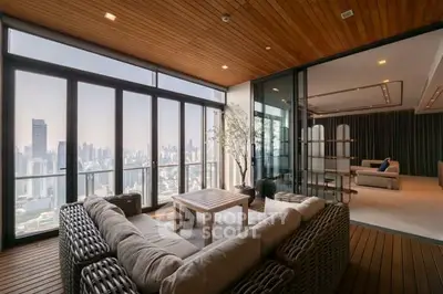 Luxurious high-rise apartment with stunning city view and spacious balcony.